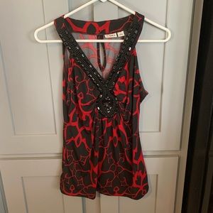 Cato’s black/red printed blouse with a beaded neck